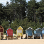 Multicoloured beach houses lining